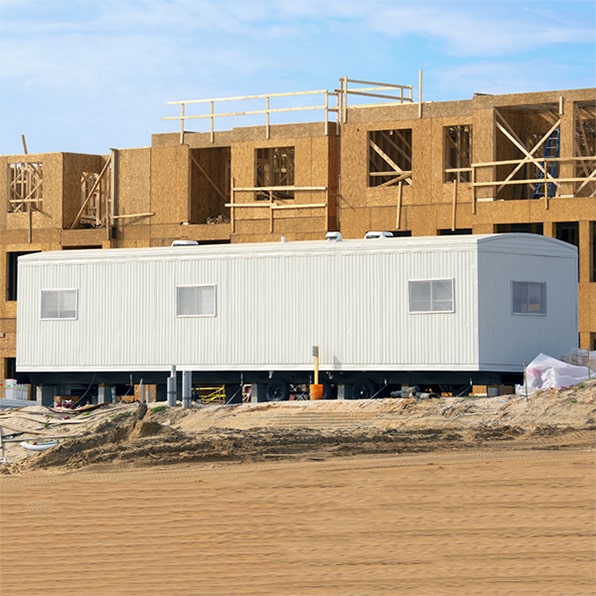 we provide delivery and setup of construction trailers to the job site for your convenience